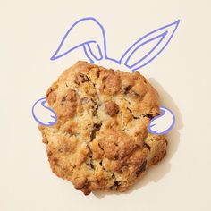 an image of a cookie with blue outlines on the top and bottom half that has been cut out to look like a bird