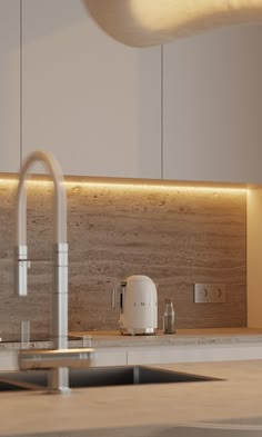 a kitchen with a sink, faucet and counter top in the middle of it