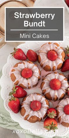 strawberry bundts with icing and strawberries on a plate