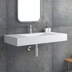 a bathroom sink sitting under a mirror next to a wall mounted toilet paper dispenser