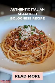 spaghetti with sauce and parmesan cheese in a white bowl