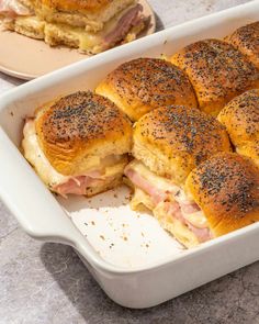 ham and cheese sliders in a white casserole dish