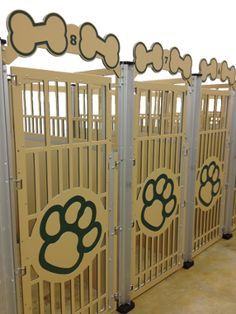 a row of dog gates with paw prints on them