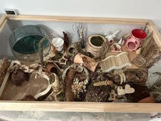 a wooden box filled with lots of different items