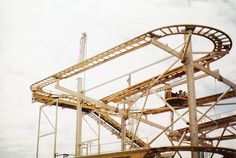 a roller coaster with people riding it