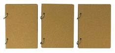 three brown notebooks lined up next to each other on a white background with clippings