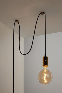 The Alamere Plug-In Pendant is the ideal swag kit lamp for any space. Easy to install, it plugs into any standard wall outlet and comes with two cord anchors to hang it anywhere. An inline dimmer on the cord allows for adjustability with any compatible dimming light bulb. Lightbulb Hanging From Ceiling, Cord Light Hanging Bedroom, Hanging Bulb Lights Bedroom, Bedside Hanging Pendant Lights, Vintage Hanging Lights In Bedroom, Modern Plug In Pendant Light, Pendant Plug In Light, Cord Light Hanging, Corner Wall Light