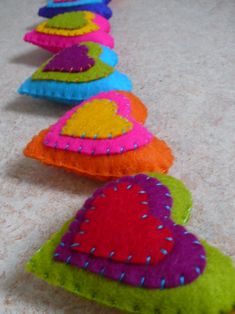 several different colored pillows are lined up on the floor