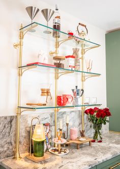 a kitchen counter topped with lots of shelves