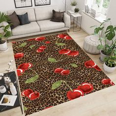 a leopard print rug with red apples on it