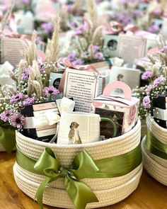 two baskets filled with baby's breath items on top of a wooden table next to each other