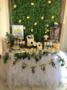 a table with lemons and cupcakes on it