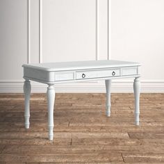 a white table with two drawers on one side and an open drawer on the other