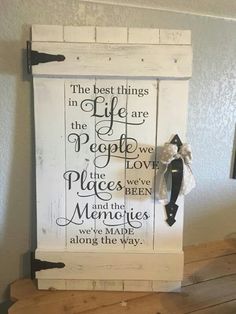 a wooden sign that says the best things in life are people