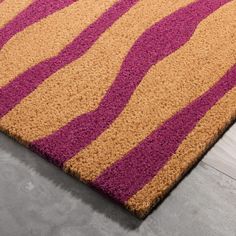 a purple and yellow rug on the floor