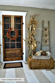 an old door is decorated with fall decorations