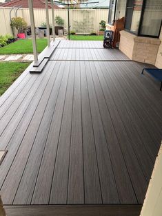 a wooden deck in front of a house