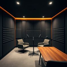 an empty room with two chairs and a microphone in the corner, next to a wooden table