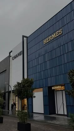 the front of a building with people standing outside