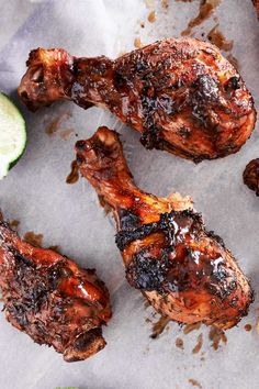 grilled chicken wings with lime wedges on the side