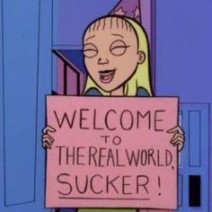 a cartoon character holding a sign that says welcome to the real world suckerr on it