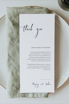 a place setting with a folded thank you card