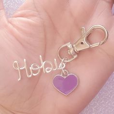 Do you love Hobi? This is the best bag charm or keychain for every BTS fan! Available in Stunning Silver with this beautiful purple heart! We bet you can't wait to get this and show all of your BTS-lover friends! We use NON-TARNISH silver plated copper wire - 16 gauge. Beautifully made and very sturdy. Made and shipped from the USA. Trendy Custom Name Silver Jewelry, Trendy Silver Jewelry With Custom Name, Trendy Personalized Silver Jewelry, Trendy Personalized Metal Jewelry, Trendy Custom Name Jewelry For Everyday, Trendy Custom Name Jewelry For Everyday Wear, Trendy Purple Jewelry For Gift, Trendy Charms Jewelry For Best Friend Gift, Cute Personalized Metal Jewelry