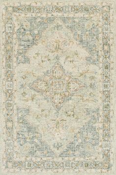 a rug with an ornate design on the top and bottom, in light blue tones