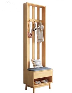 a wooden bench with shoes on it next to a coat rack and two coats hanging from hooks