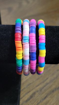 several bracelets are stacked on top of each other