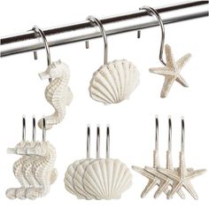 six seashells and starfish hangers on a metal bar