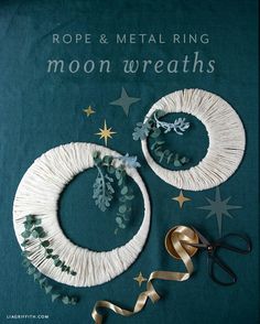 paper and metal ring moon wreaths with scissors on the side, surrounded by stars