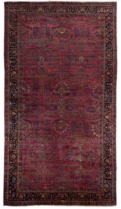 an antique persian rug with red and blue colors