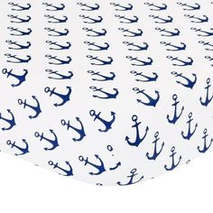 the blue and white anchor print on this fitted crib sheet is perfect for baby's nursery