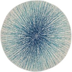 a blue and white circular rug on a white background