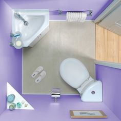 an overhead view of a bathroom with purple walls