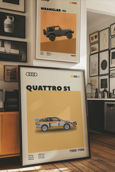 an advertisement for the new audi quattro s1 car is displayed in front of some framed photographs