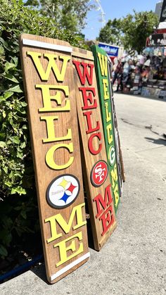 a wooden sign that says welcome to the game