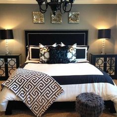 a black and white bed with pillows on it