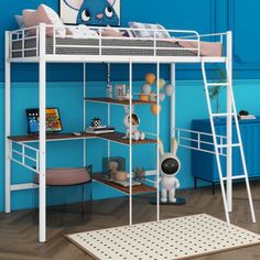 a white bunk bed sitting on top of a wooden floor next to a blue wall