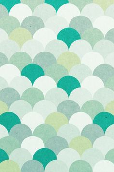 a green and white wallpaper with circular shapes on it's surface, in shades of teal