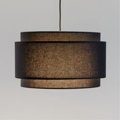 a brown and black lamp hanging from a ceiling