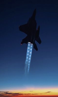 an air force jet flying through the sky at night with lights coming from it's tail