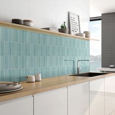 a kitchen with blue tiles and wooden counter tops