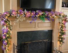 a fireplace decorated for christmas with purple and green ribbons on it's mantle, next to a flat screen tv