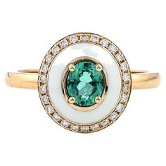 White Enamel Cocktail Ring, with Oval cut Emerald Center surrounded by brilliant cut pave Diamonds, in 18kt Rose Gold. Unique Cocktail Ring with green emerald stone, set among four prongs handcrafted in 18Kt gold. The white enameling makes the emerald beam to illuminates the ring. This jewelry piece belongs to Metalloplasies Collection, fragments of creativity, representing all different paths Nicofilimon has walked on during his career. This awesome piece of fine jewelry is a true testament to Oval Emerald Ring With Pave Setting, Oval Green Jewelry With Pave Setting, Green Oval Jewelry With Pave Setting, Signet Rings, Enamel Ring, Emerald Earrings, Emerald Stone, Green Emerald, Enamel Jewelry