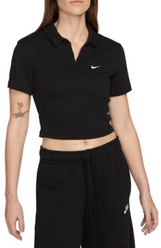 This trim stretch-jersey polo ups the stakes in the style game with a cropped profile and a button-free placket. 18" length (size Medium) Half placket Spread collar Short sleeves 97% cotton, 3% spandex Machine wash, tumble dry Imported Fitted Collared Athleisure Tops, Nike Collared Tops For Spring, Nike Sports Crop Top, Nike Collared Sports Tops, Nike Classic Collared Tops, Nike Classic Fitted Tops, Classic Nike Collared Tops, Classic Fitted Nike Tops, Classic Collared Nike Tops