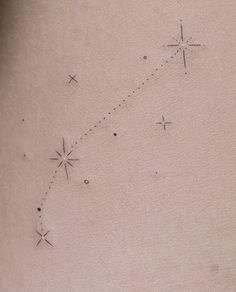 a woman's stomach with stars on it and a line drawn across the side