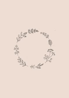 a black and white drawing of a circle with leaves on the side, in front of a light pink background