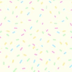 a white background with multicolored sprinkles